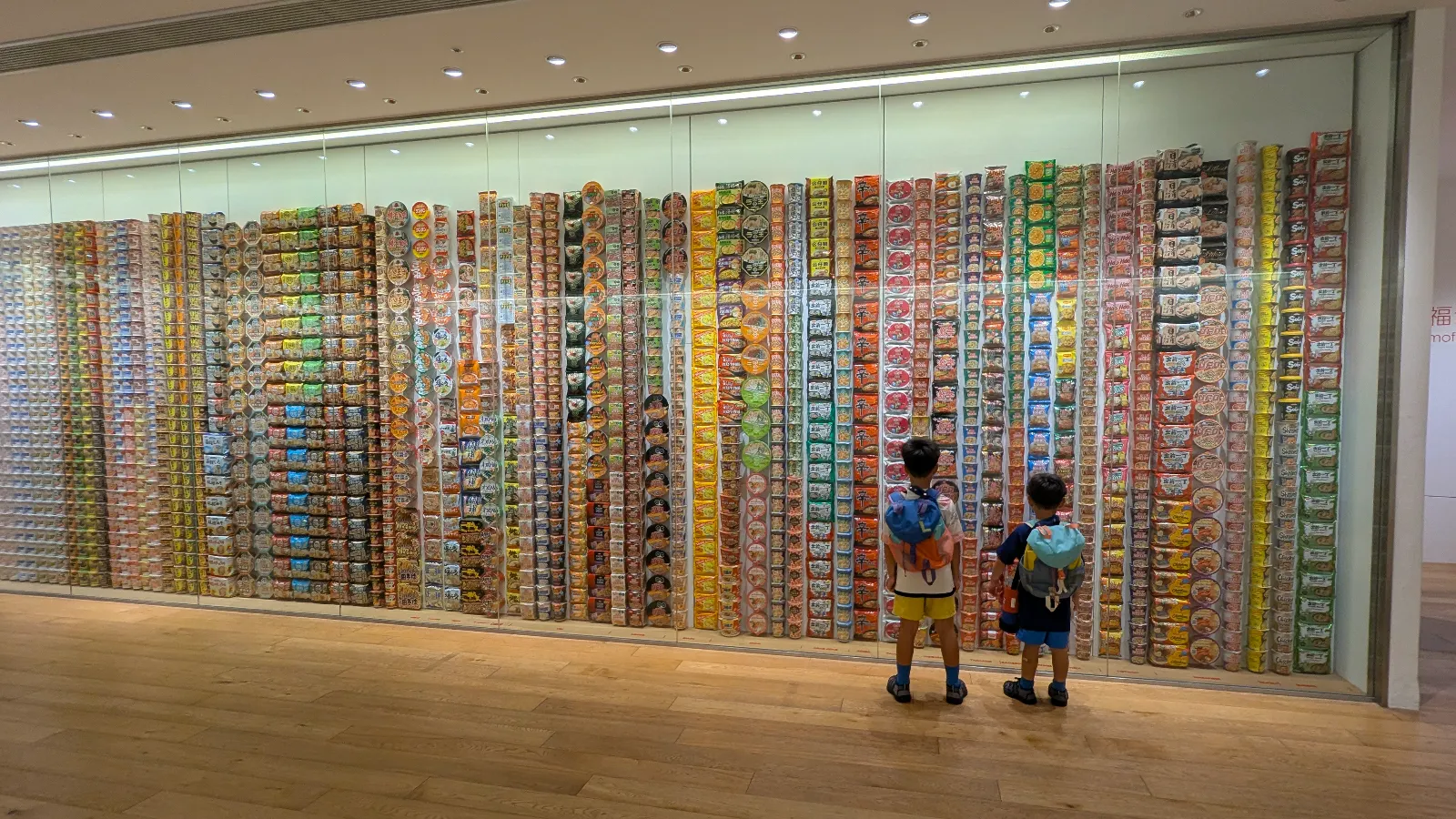 Colorful wall of instant noodles at Cup Noodles Museum Yokohama, Japan, popular family attraction