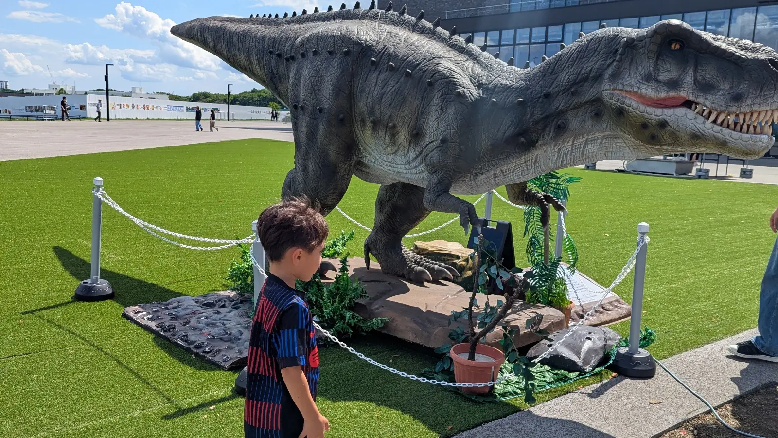 A young boy explores the dinosaur exhibit at F Village near Es Con Field Hokkaido, one of the fun family attractions outside the ballpark.