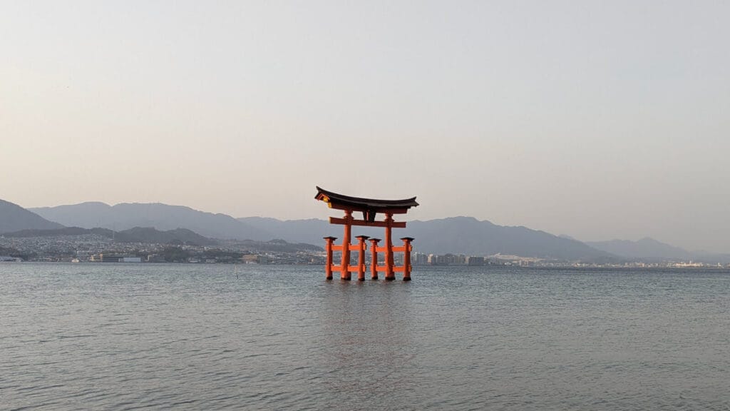 Iconic floating torii gate of Itsukushima Shrine off the coast of Miyajima Island, viewed during a spring family adventure in Japan