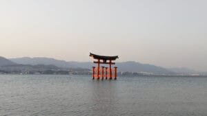 Iconic floating torii gate of Itsukushima Shrine off the coast of Miyajima Island, viewed during a spring family adventure in Japan