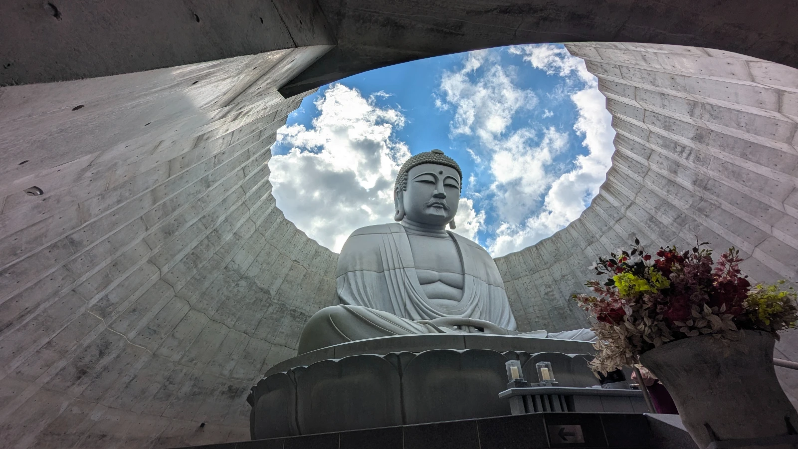 View of the Tadao Ando–designed Hill of the Buddha in Sapporo, seen through the open sky ring above the lavender-covered hill.