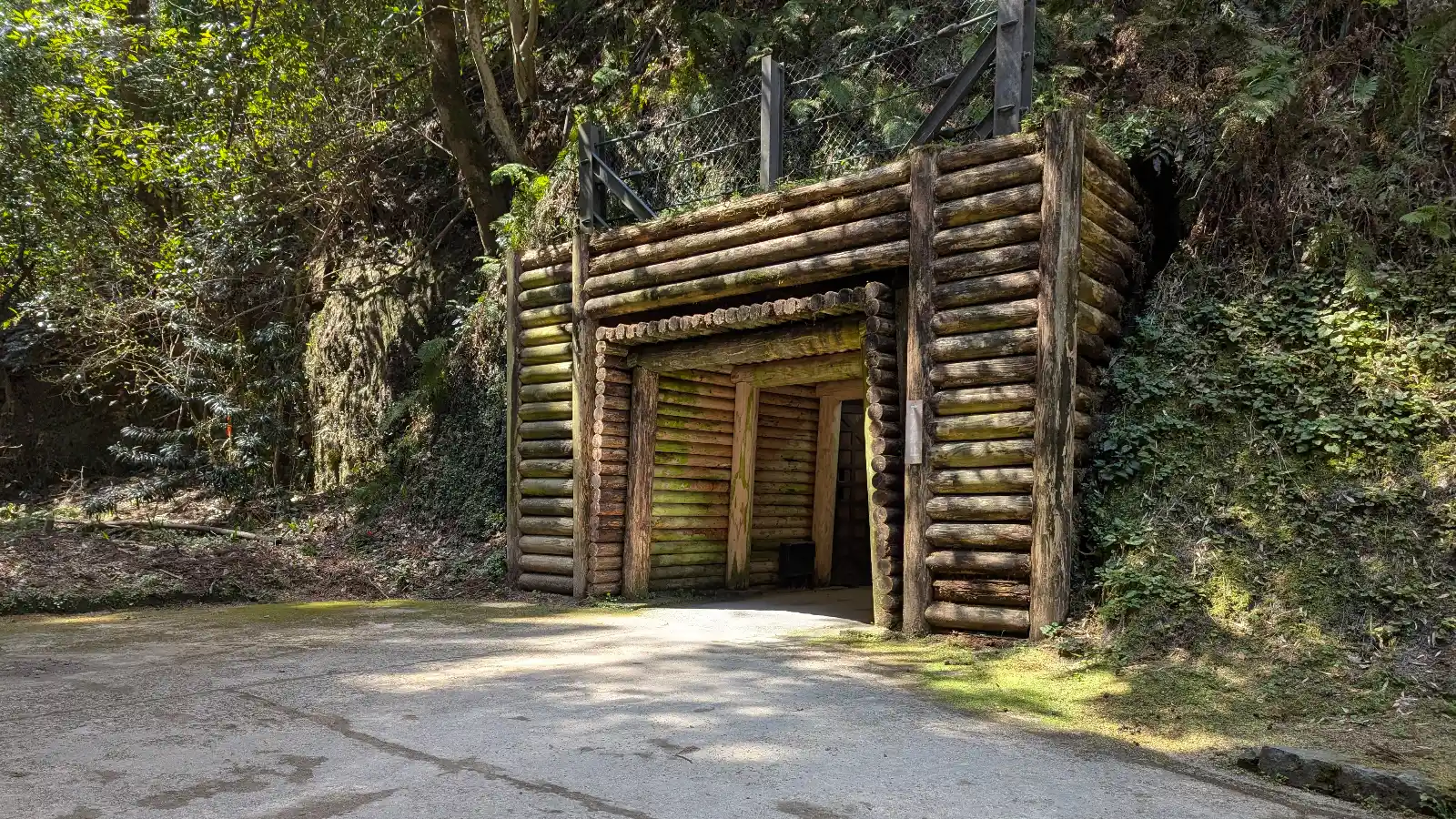 Entrance to the Iwami Ginzan silver mine in Japan, surrounded by forest, a quiet spring destination for family travel and exploration with kids