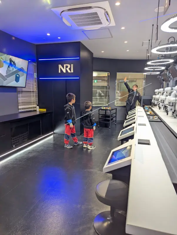 Children working as Digital Engineers in a tech-focused workshop at KidZania Fukuoka, highlighting educational activities for kids in Japan.