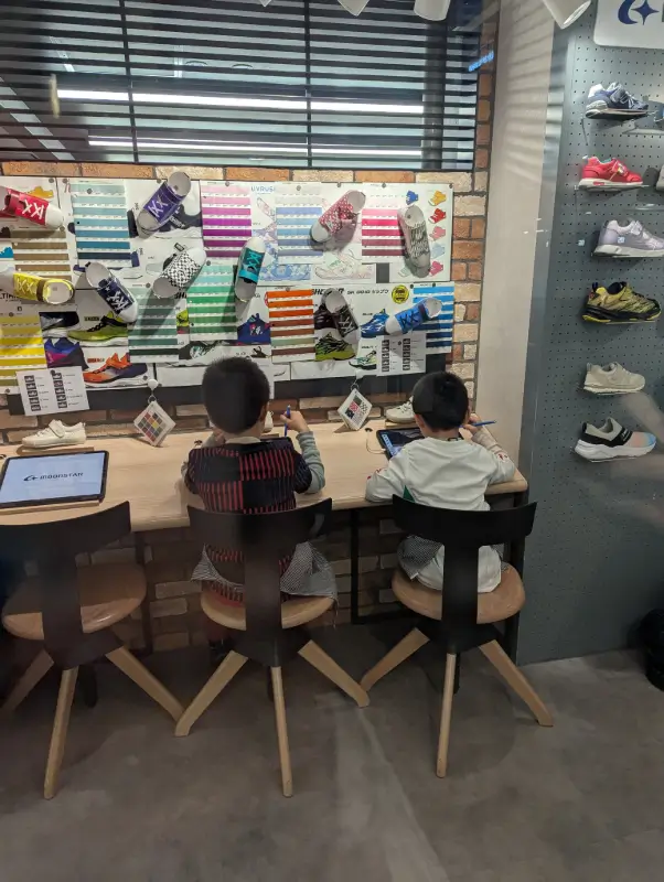 Kids designing custom footwear as Shoe Designer at KidZania Fukuoka, showcasing creative and interactive activities in Japan