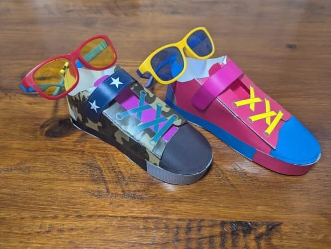 Colorful, custom-designed paper shoes and sunglasses created by kids at the Shoe Factory and Zoff at KidZania Fukuoka.