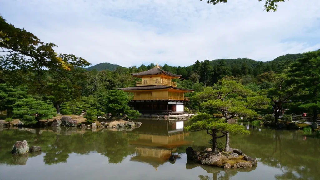 Kinkaku-ji Golden Pavilion reflected in the pond, a must-see family-friendly temple in Kyoto, Japan