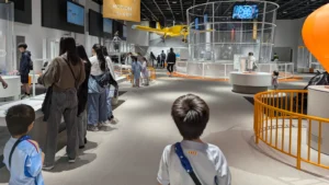 The Motion Gallery at Kobe Bando Science Museum filled with interactive science stations, perfect for springtime learning and exploration with kids in Kobe.