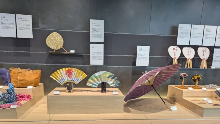Traditional Kyoto fans, umbrellas, and crafts on display at Kyoto Museum of Crafts and Design, a top indoor activity for kids.