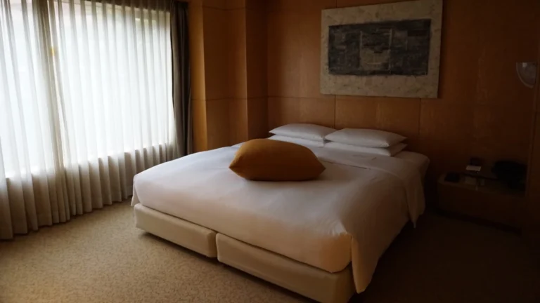 Elegant king room at a luxury family-friendly hotel in Fukuoka, Japan, featuring soft lighting, clean design, and peaceful decor, ideal for relaxing with kids after exploring the city.