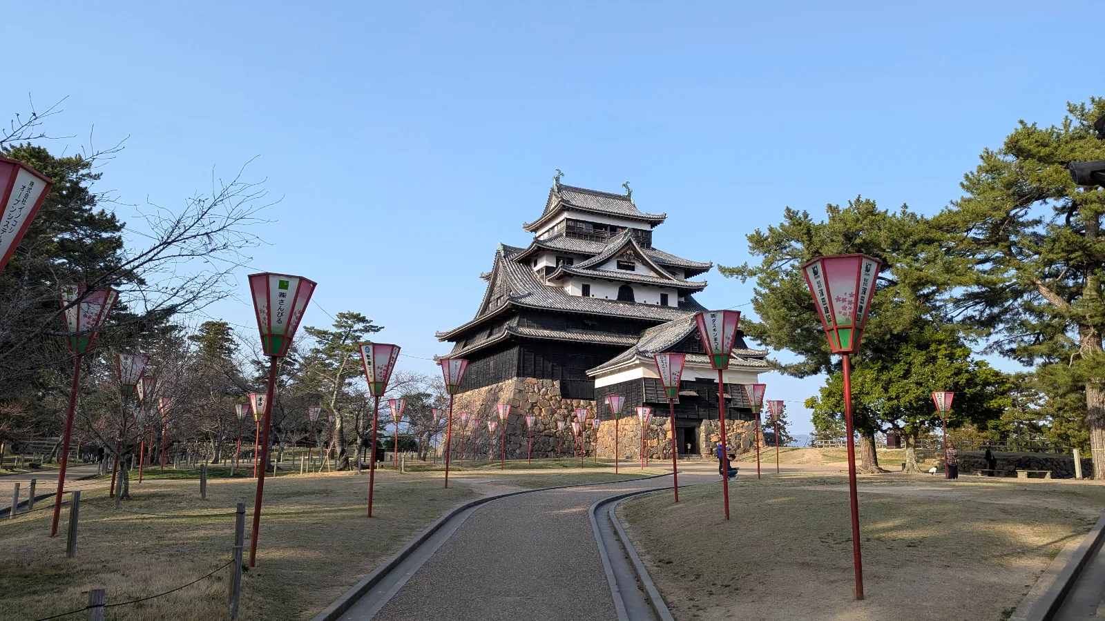 Matsue Castle in Shimane, one of Japan’s 12 original castles, surrounded by lanterns along the path to the entrance.
