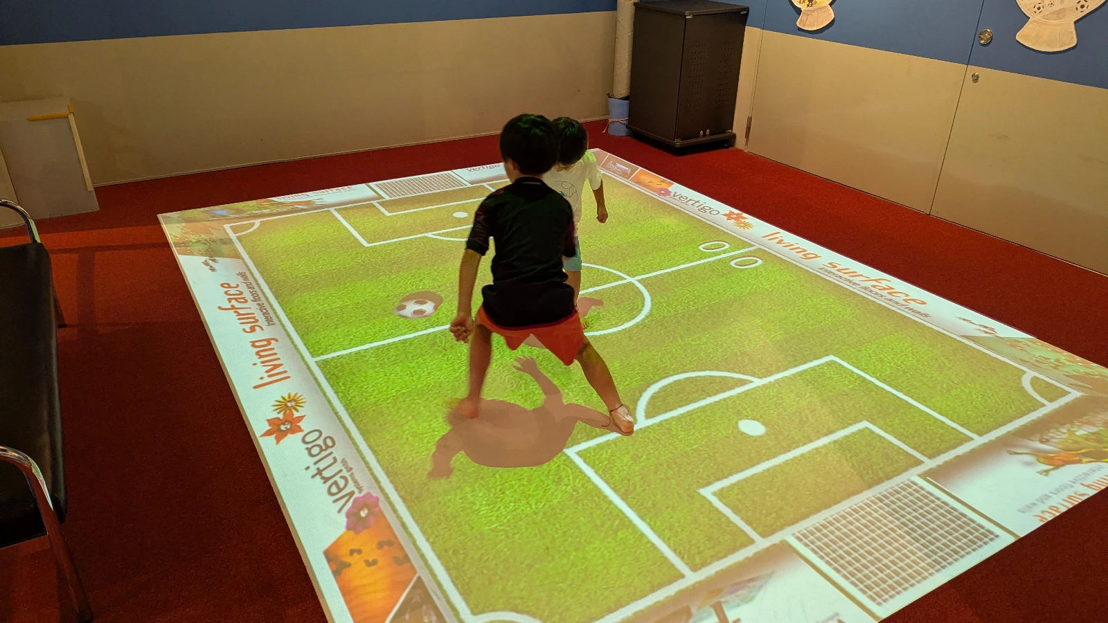 Luca & Nico play shadow soccer at Miyazaki Science Center, a hands-on, family-friendly museum in Japan with interactive science exhibits.