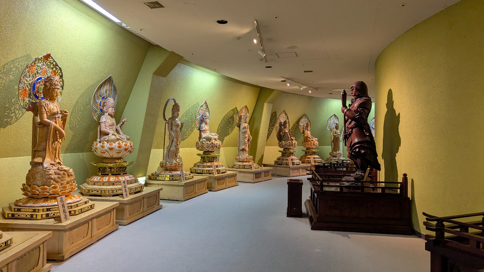 Row of intricate Buddhist statues displayed inside the Sendai Dai Kannon, part of the peaceful interior families can explore during their visit.