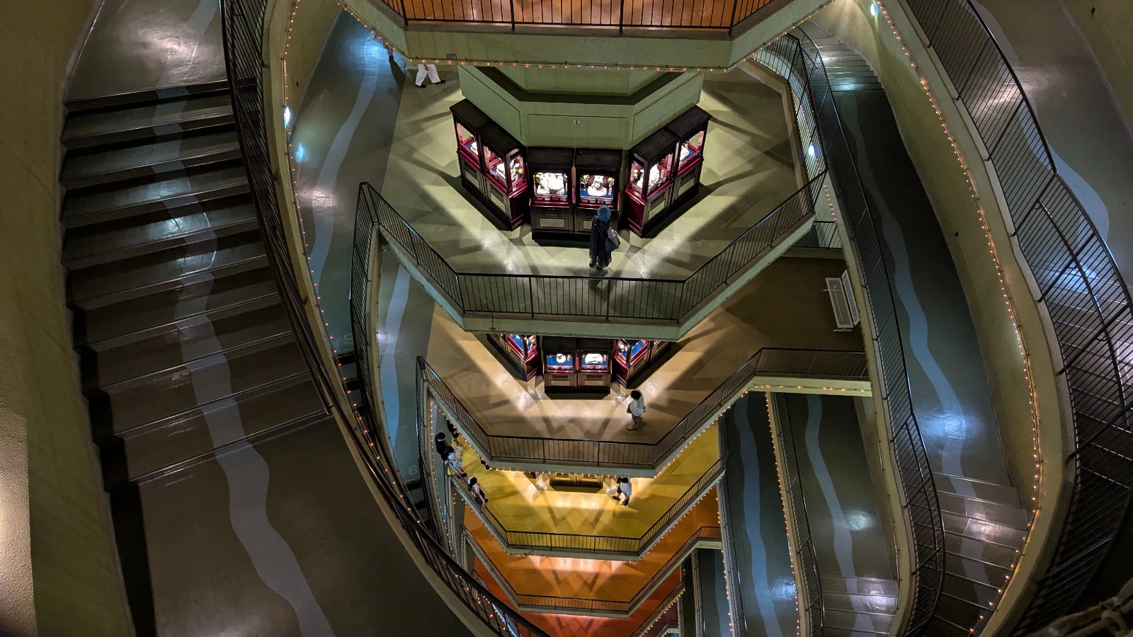 Inside the Sendai Dai Kannon statue showing multi-level floors and exhibits, where families can explore Buddhist art and guardian deities.