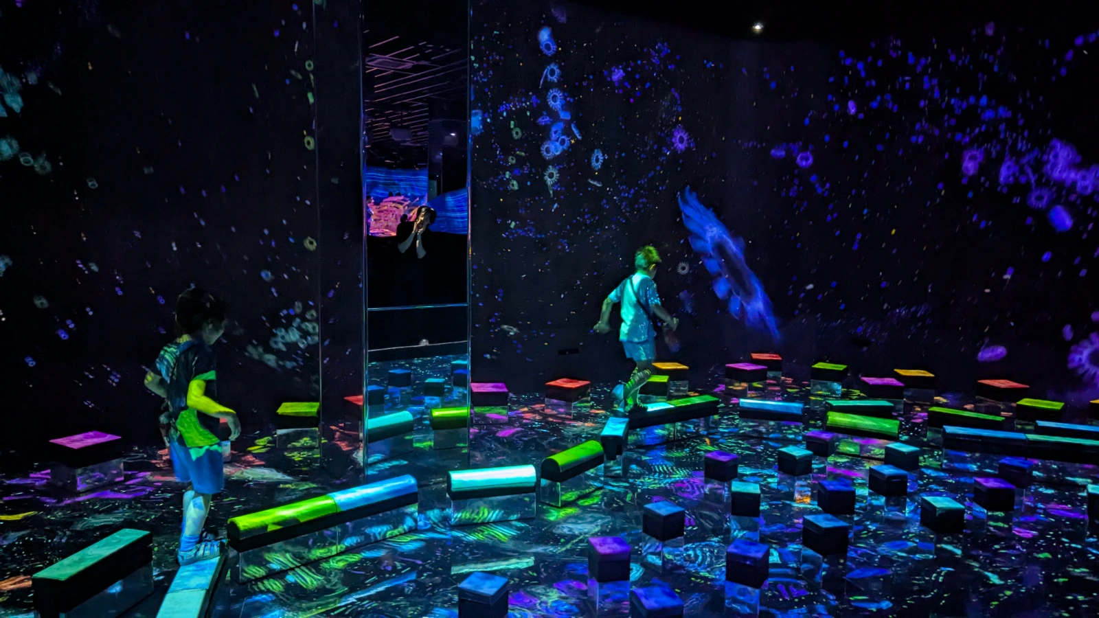 Luca and Nico in the mirrored jellyfish room at teamLab Biovortex in Kyoto, Japan.