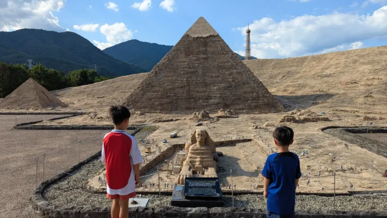 Children viewing the miniature Great Pyramid and Sphinx at Tobu World Square in Nikko, Japan.