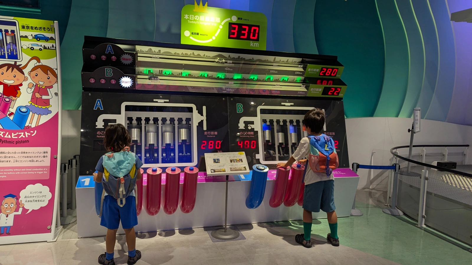 Luca and Nico play a piston engine game at the Toyota Commemorative Museum of Industry and Technology in Nagoya.