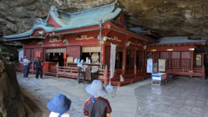 Luca & Nico approach Udo Shrine (Jingu), a coastal cave temple in Miyazaki Japan, one of the most scenic and family-friendly shrines in the country.
