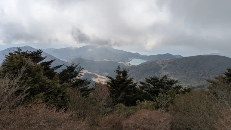 Scenic mountain view from Nita Pass in Unzen, Japan, with misty peaks and forested hills, perfect for a family day of hiking with kids.
