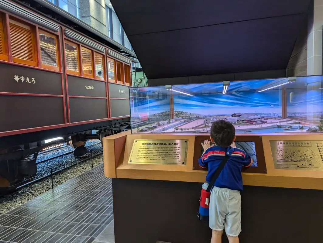 Nico explores a historical train display at a Yokohama museum, one of the city’s top kid-friendly indoor attractions.