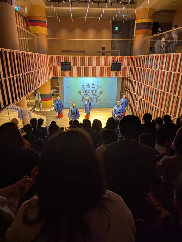 Traditional naruko dance performance at OMO7 Kochi, seen by families attending the hotel’s cultural evening show.